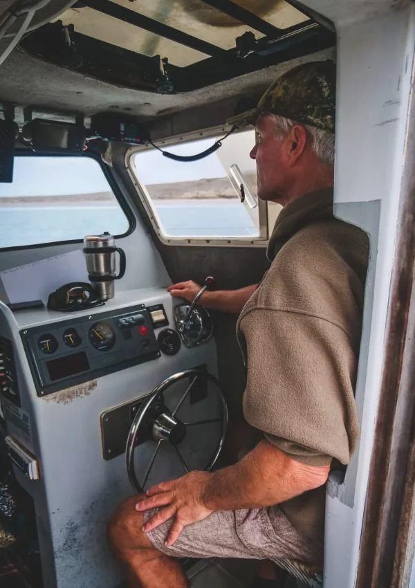 fisherman driving boat